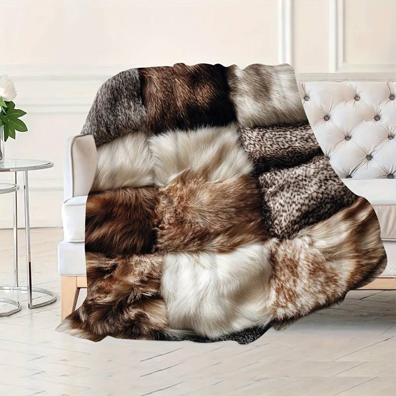 Plaid fausse fourrure patchwork marron gris blanc sur fauteuil Image