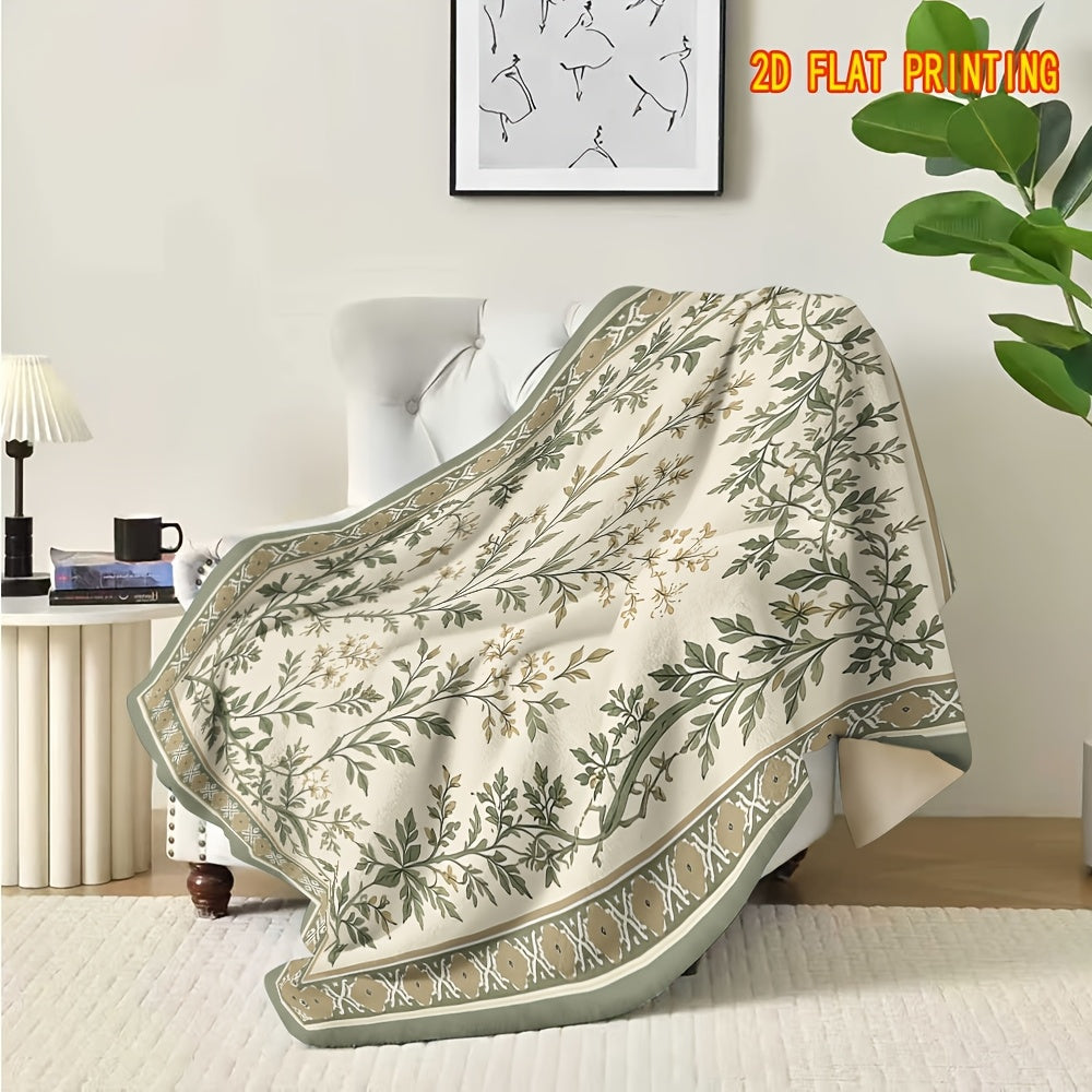 Plaid flanelle bohème motif sauge sur fauteuil