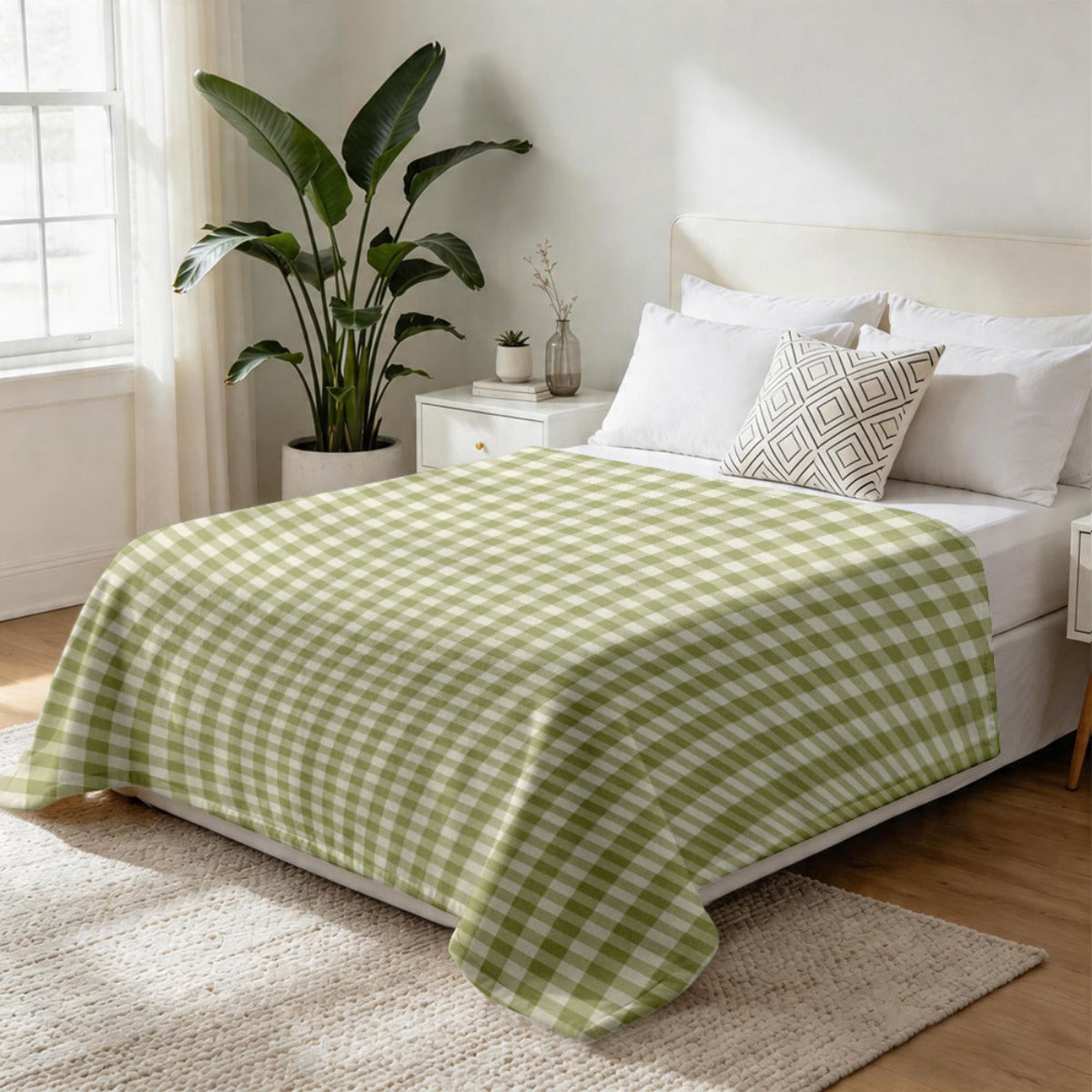 Plaid vichy vert sauge sur un lit